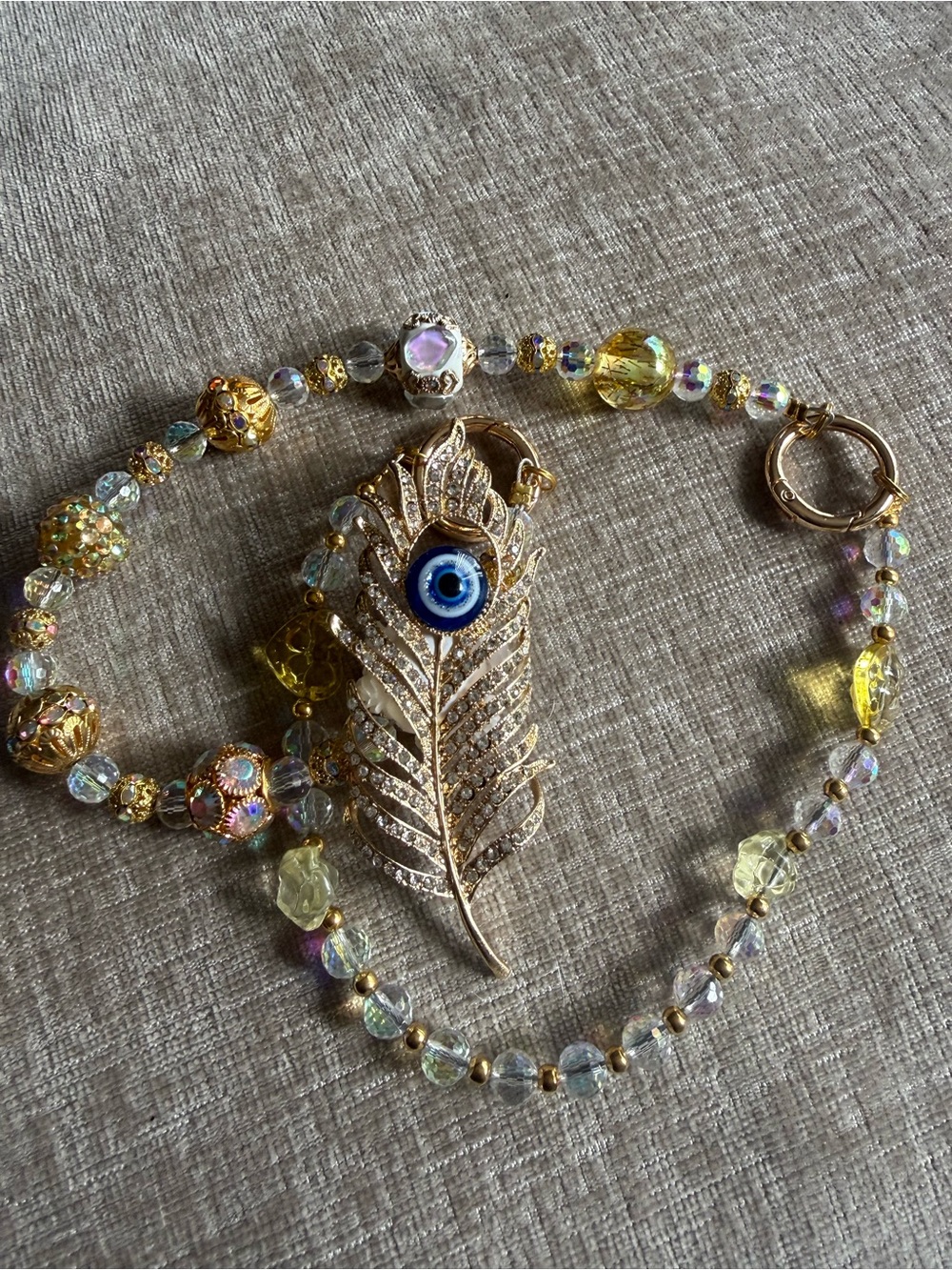 Gold-Tone Feather Evil Eye Pendant Necklace - Yellow Crystal Beads purse or bag